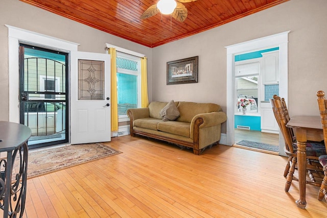 1221 S Madison St, Appleton, WI 54915 - living area with visible vents, ornamental molding, light wood-type flooring, wood ceiling, and a ceiling fan