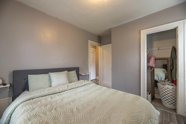 bedroom with wood finished floors