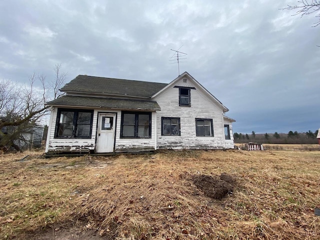 186 Abrahams Rd, Skandia, MI 49885 - rear view of house with a shingled roof
