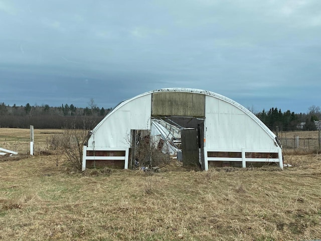 186 Abrahams Rd, Skandia, MI 49885 - view of pole building with fence