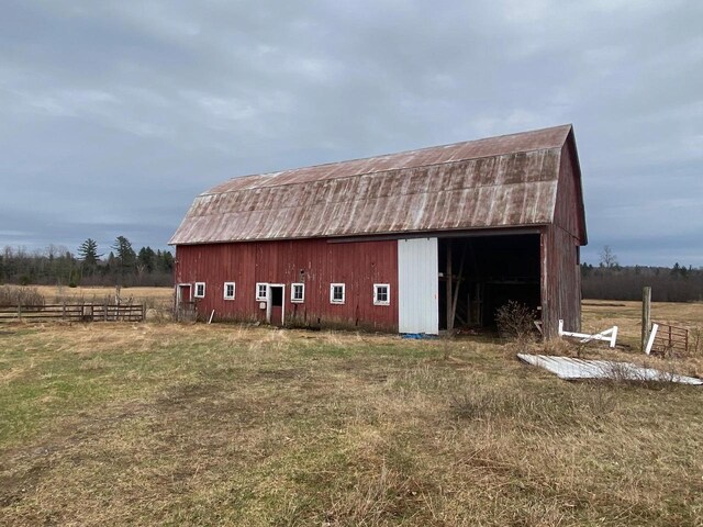 186 Abrahams Rd, Skandia, MI 49885 - view of barn featuring fence