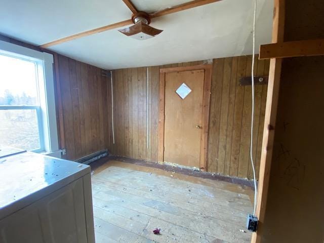 186 Abrahams Rd, Skandia, MI 49885 - unfurnished room featuring ceiling fan and wooden walls