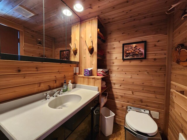 26297 State Highway 60, Lone Rock, WI 53556 - bathroom with visible vents, wood walls, wood ceiling, and vanity