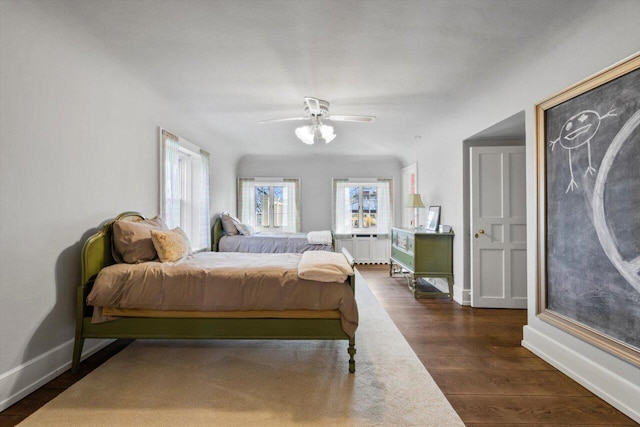 bedroom with baseboards, dark wood-style floors, and ceiling fan