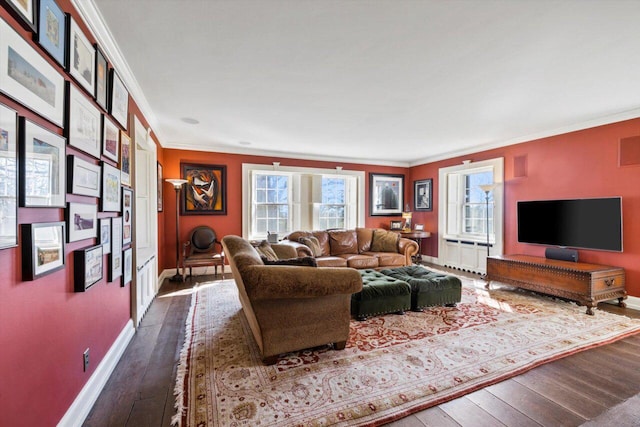 living area with baseboards, dark wood-style flooring, crown molding, and a wealth of natural light