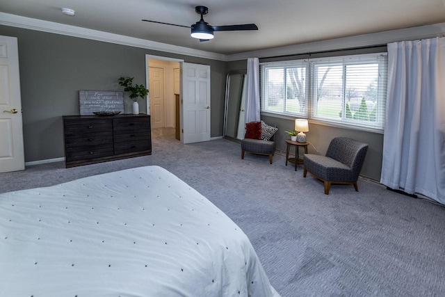 carpeted bedroom with baseboards, ceiling fan, and ornamental molding