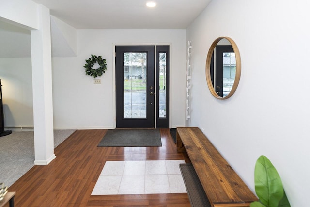 entrance foyer featuring recessed lighting, baseboards, a wealth of natural light, and wood finished floors