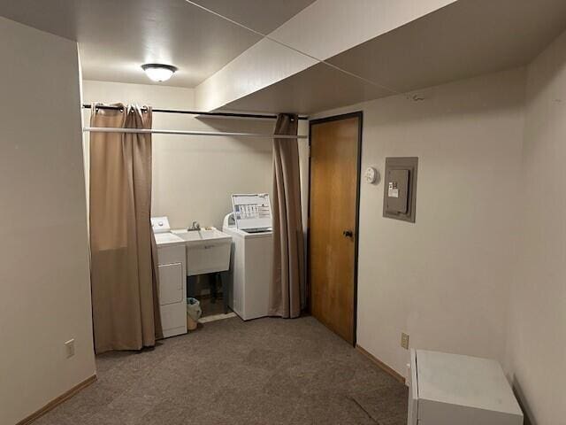 laundry area with electric panel, laundry area, carpet floors, baseboards, and washer and dryer