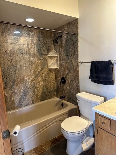 full bathroom featuring toilet, shower / washtub combination, and vanity