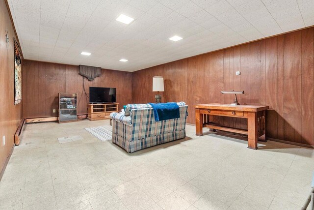 901 E Grant St, Appleton, WI 54911 - living room featuring wooden walls and tile patterned floors
