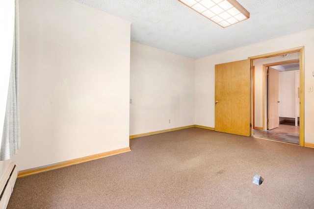 901 E Grant St, Appleton, WI 54911 - carpeted empty room with baseboards and a baseboard heating unit