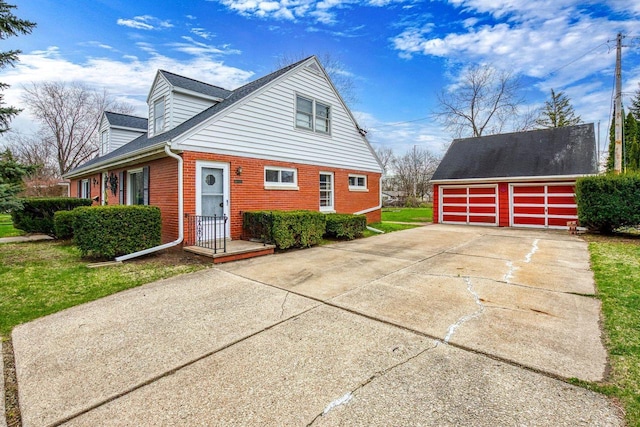 901 E Grant St, Appleton, WI 54911 - view of property exterior with brick siding and an outbuilding