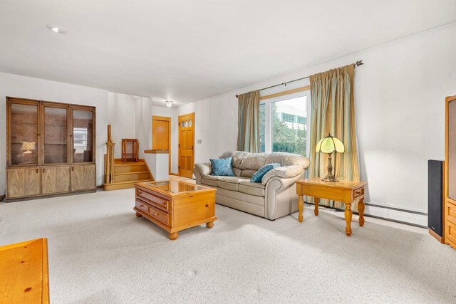 901 E Grant St, Appleton, WI 54911 - carpeted living area with stairway and a baseboard radiator