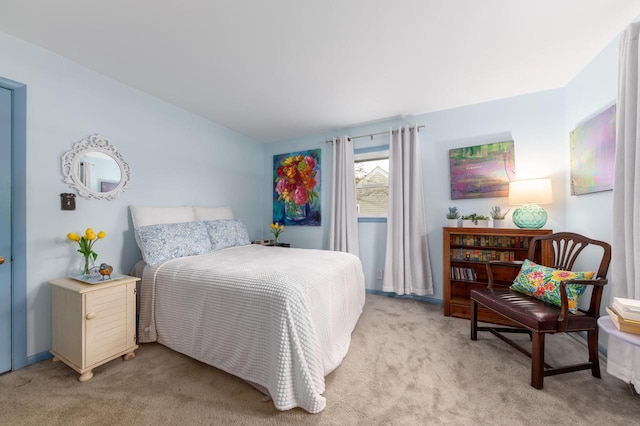 bedroom with light colored carpet