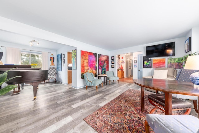 living room featuring baseboards and wood finished floors