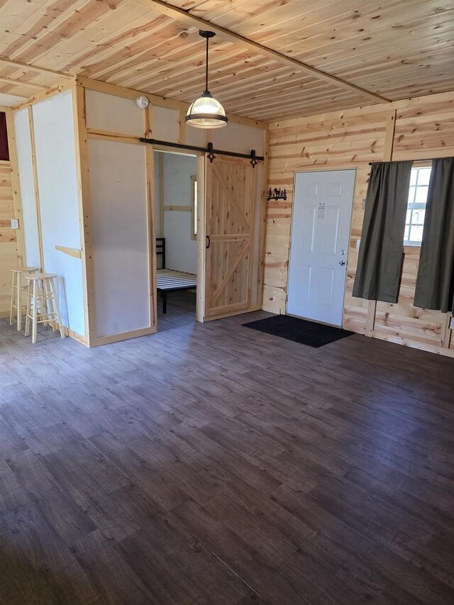 W10686 County Road X, Crivitz, WI 54114 - interior space with wooden walls, wooden ceiling, a barn door, and wood finished floors