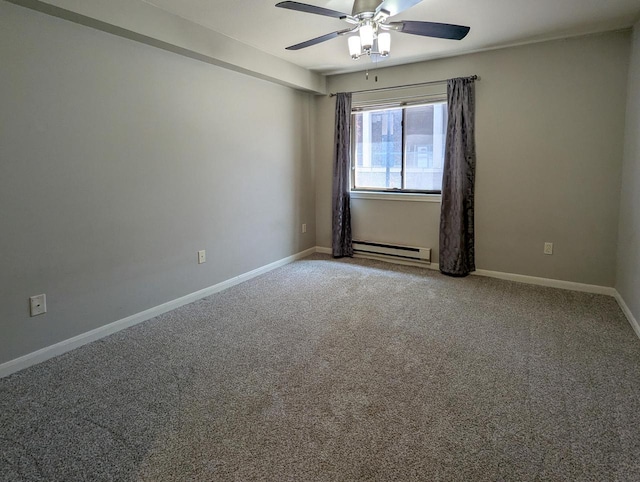 carpeted spare room with ceiling fan, a baseboard heating unit, and baseboards