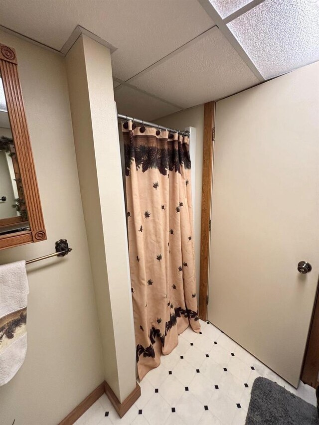 5021 Margaret Dr, Amherst, WI 54406 - bathroom with tile patterned floors and a shower with shower curtain