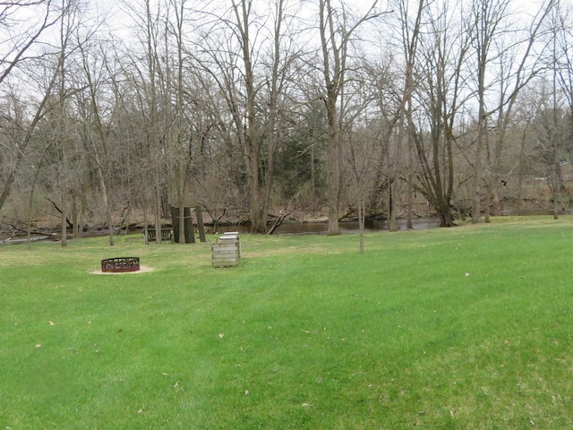 5021 Margaret Dr, Amherst, WI 54406 - view of green lawn featuring an outdoor fire pit