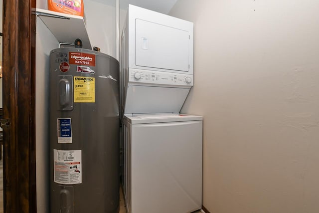washroom with laundry area, stacked washer / dryer, and electric water heater