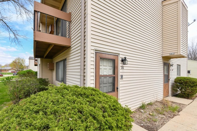 view of side of home with a balcony