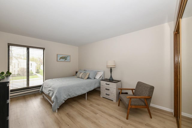 bedroom featuring light wood-style floors