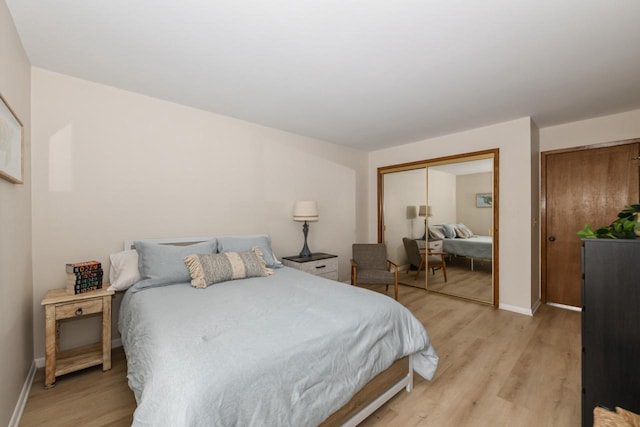 bedroom featuring baseboards and light wood-type flooring