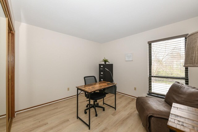 home office with light wood-type flooring
