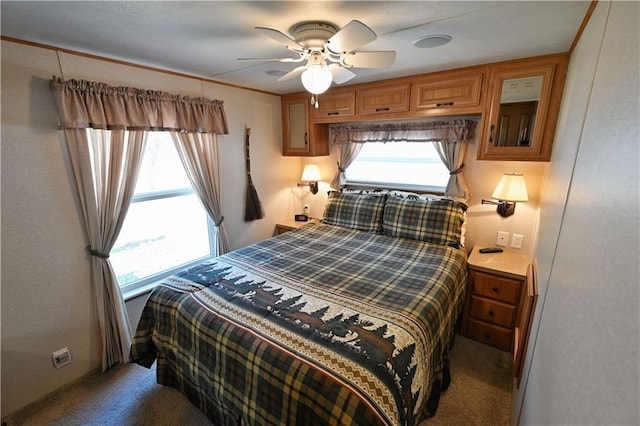 carpeted bedroom with a ceiling fan
