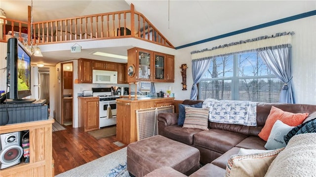 living area with dark wood-style flooring and high vaulted ceiling