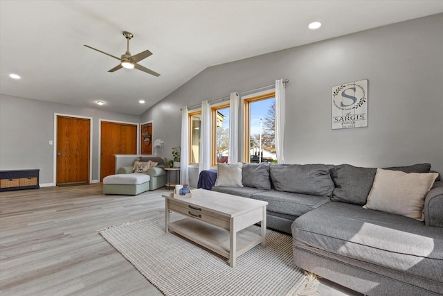 living area with recessed lighting, a ceiling fan, light wood finished floors, and vaulted ceiling