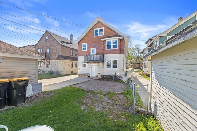 2562 N 68th St Unit 2564, Wauwatosa, WI 53213 - rear view of house featuring cooling unit, a gate, and a patio area