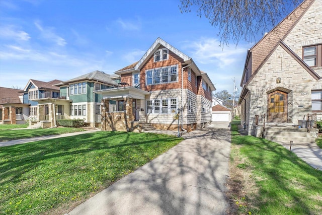 2562 N 68th St Unit 2564, Wauwatosa, WI 53213 - view of front facade featuring an outbuilding, a front lawn, a detached garage, and stone siding