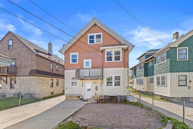 2562 N 68th St Unit 2564, Wauwatosa, WI 53213 - view of front of house with a balcony, fence, and central air condition unit