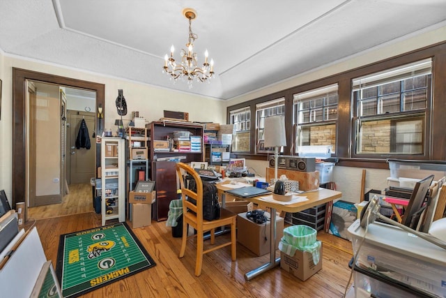 2562 N 68th St Unit 2564, Wauwatosa, WI 53213 - dining space with wood-type flooring, a chandelier, ornamental molding, a desk, and a raised ceiling