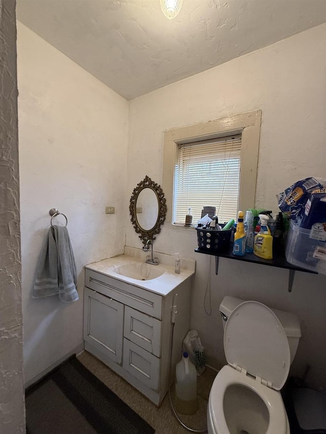 904 Elm St, Beloit, WI 53511 - half bathroom featuring vanity and toilet