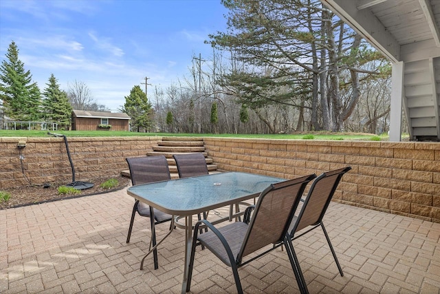 view of patio featuring outdoor dining area