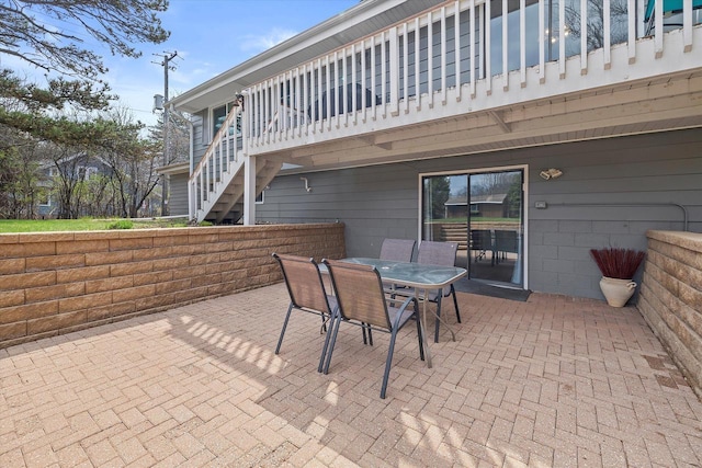 view of patio / terrace with stairway and outdoor dining area