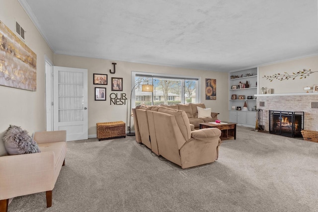 living area featuring visible vents, ornamental molding, carpet floors, a fireplace, and built in shelves