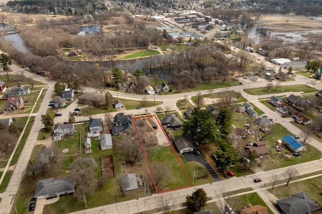 233 N 1st St, Princeton, WI 54968 - aerial perspective of suburban area with property boundaries highlighted and a large body of water