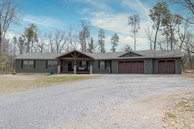 436 Duffers Trl, Nekoosa, WI 54469 - ranch-style home with a porch, an attached garage, and gravel driveway