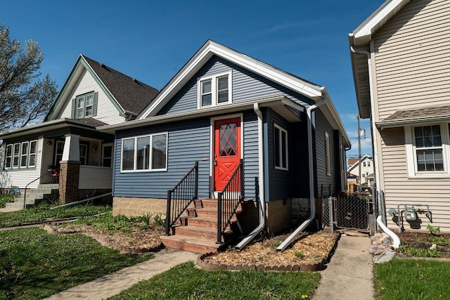 bungalow featuring a gate and entry steps