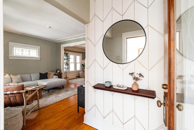 interior space featuring ornamental molding and wood finished floors