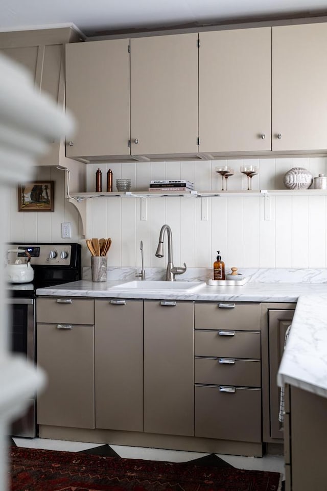 kitchen featuring a sink, gray cabinets, open shelves, and stainless steel range with electric cooktop