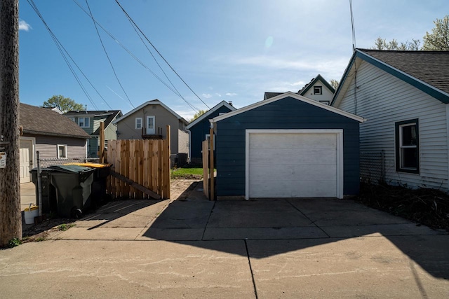 exterior space with fence and concrete driveway