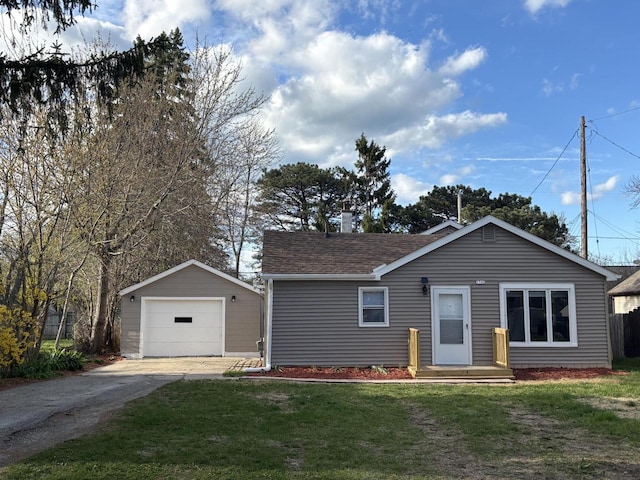 1742 Kremer Ave, Racine, WI 53402 - ranch-style home featuring an outbuilding, driveway, a front lawn, a detached garage, and a shingled roof