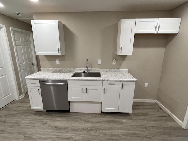 1742 Kremer Ave, Racine, WI 53402 - kitchen featuring dishwasher, a sink, white cabinets, and wood finished floors