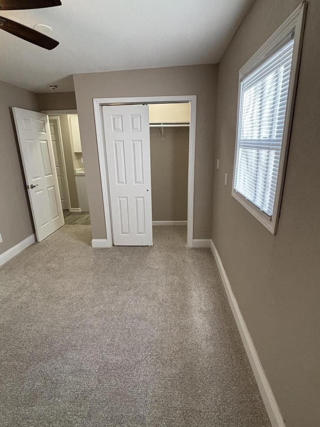 1742 Kremer Ave, Racine, WI 53402 - unfurnished bedroom with baseboards, a closet, and light colored carpet