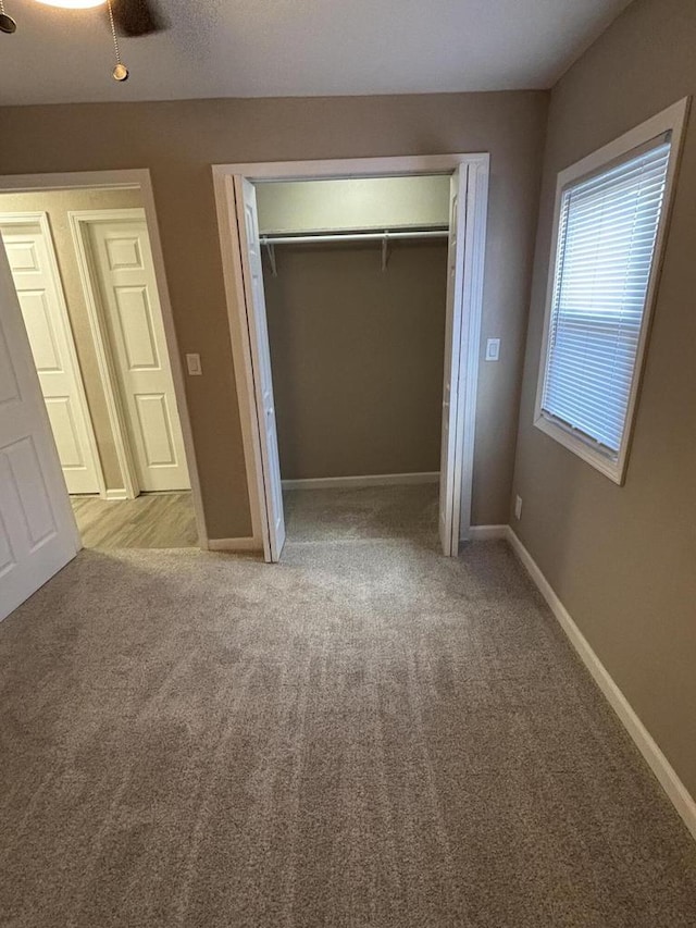 1742 Kremer Ave, Racine, WI 53402 - unfurnished bedroom featuring a closet, carpet flooring, and baseboards