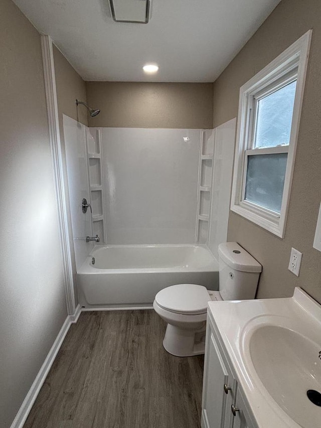 1742 Kremer Ave, Racine, WI 53402 - bathroom with wood finished floors, toilet, shower / bath combination, vanity, and baseboards